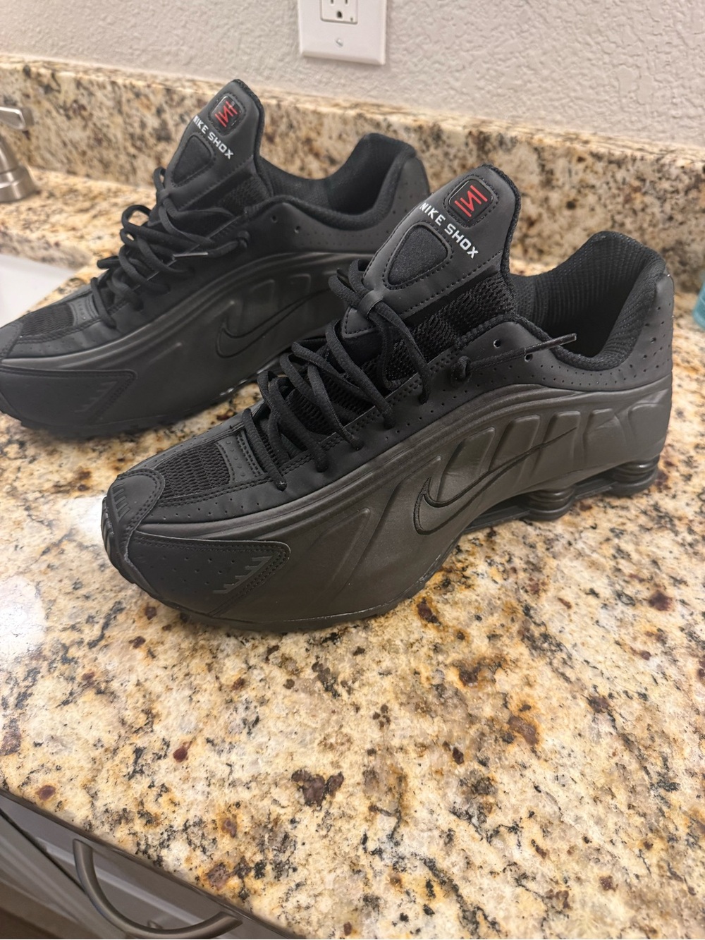 Nike Shox Men’s Black Running Sneakers with Subtle Red Accents